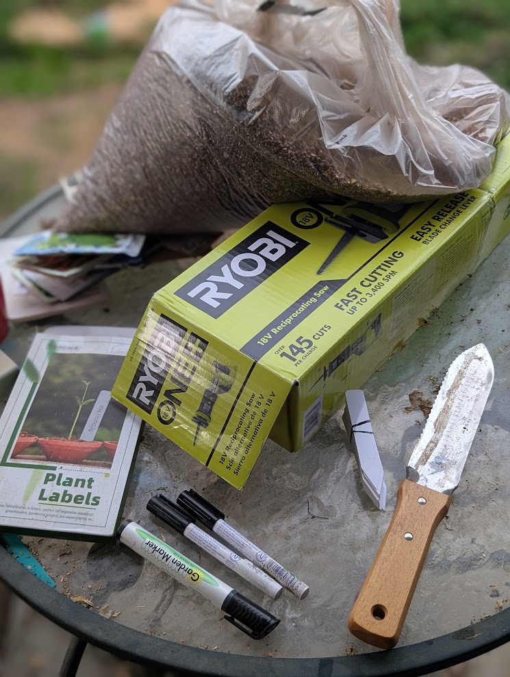 Essential garden tools arranged on a potting bench